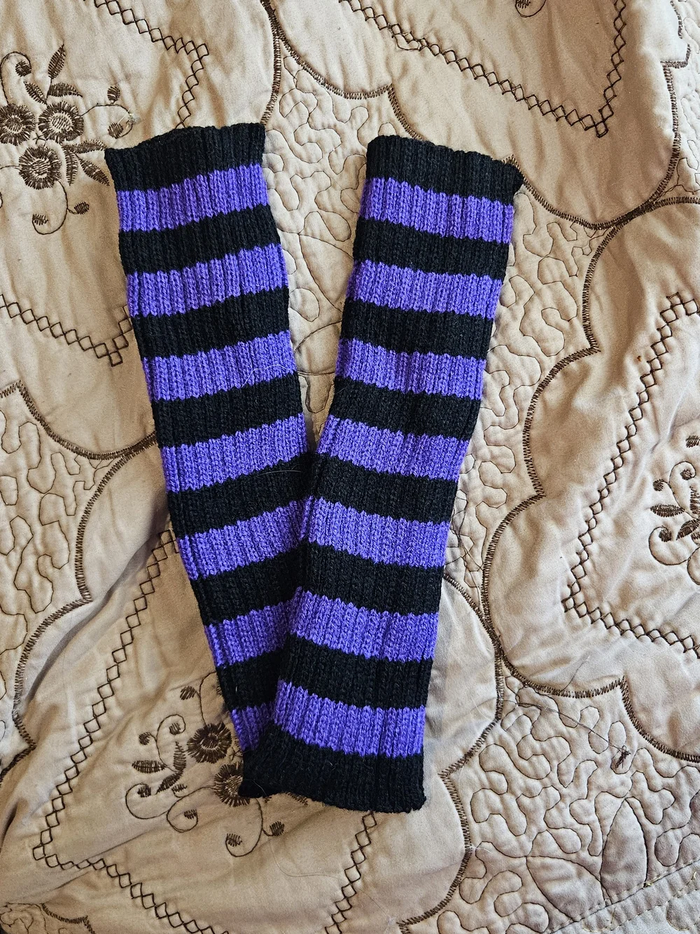 black and purple arm warmers